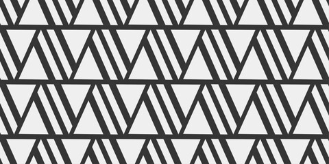 Black and white pattern of triangles. Seamless pattern of white triangles.