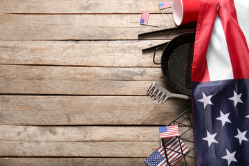 Composition with flag of USA and barbecue utensils for Independence Day celebration on wooden...