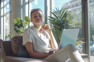 young businesswoman relaxes at his laptop in a bright modern office