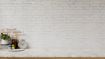 A white marble tabletop features painting tools and a space against the white brick wall.