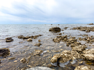 Sunny summer day on the lake. Mountains and sea. Kyrgyzstan, Lake Issyk-Kul