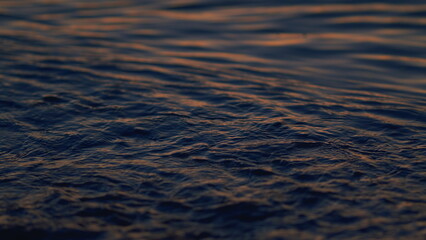 Global Warming. Wave Water With Reflection Of Sunlight At Sunset. Real time.