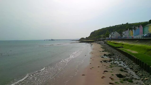 Aerial shot of Whitehead, a seaside village in Co. Antrim, Northern Ireland.

The camera travels forwards over the shoreline.

Produced in 4K, 60 frames per second and in Rec709 color space.