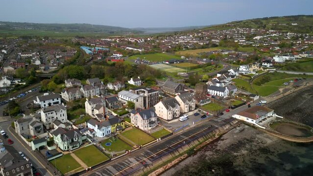 Aerial shot of Whitehead, a seaside village in Co. Antrim, Northern Ireland.

The camera begins over the sea and moves to the right.

Produced in 4K, 60 frames per second and in Rec709 color space.