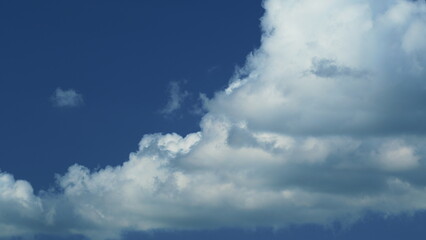 Puffy Fluffy White Clouds. Cumulus Cloud Cloudscape. White Fluffy Clouds Slowly Float Through Blue...