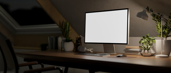 Contemporary minimalist home office workspace in the attic room at night features a computer mockup