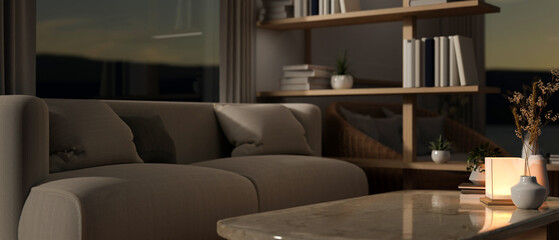 Interior design of a contemporary living room at night with dim light, a couch and a coffee table