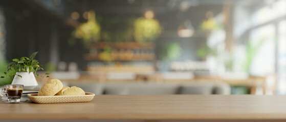 A wooden tabletop features a bread basket and a coffee cup in a modern restaurant or coffee shop.