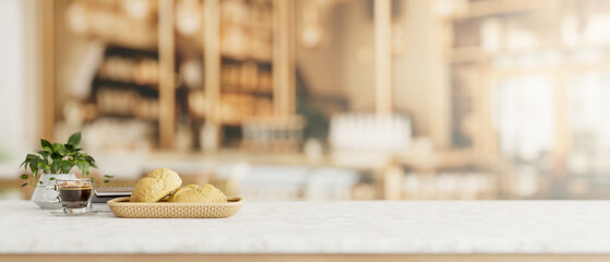 A white table features a bread basket and a coffee cup in a contemporary restaurant or coffee shop.