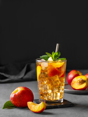 Refreshing peach iced mint tea. The concept of a healthy homemade cold summer drink