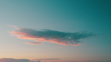 Pink Clouds Against Blue Sky At Sunset. Sunrise Clouds Are In Pink Vanilla Colours.