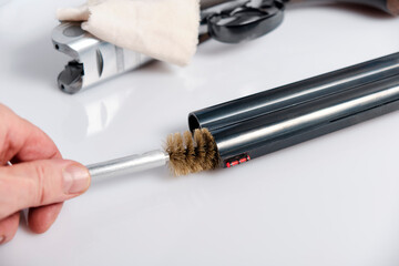 cleaning rod and a special natural bristle brush