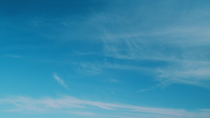 White cirrus clouds and blue colors sky. Weather was very hot in the evening. Tropical summer...