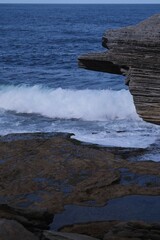 waves crashing on rocks