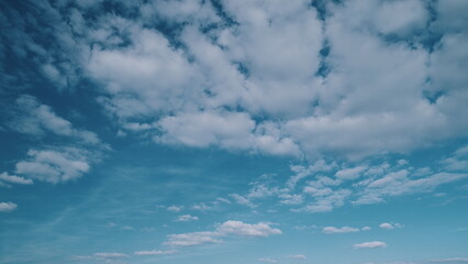 Cloudy Moving Aerial View. Beautiful Blue Sky With Clouds Moving In Opposite Direction Background. Pastel Blue Sky Sea Ocean Water On Summer Sunny Day.