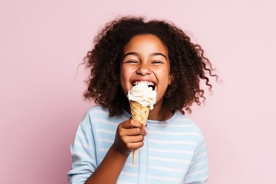 Dark-skinned African child eating ice cream in a cone and smiling happily on a pink background - Powered by Adobe