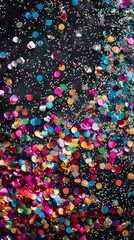 Colorful confetti explosion on black background