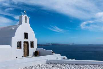 Santorini, Greece, May 4, 2024. Oia, White church in front of the sea