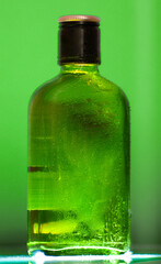 Creatively illuminated liquor bottle, a beacon of artistry in the dim.