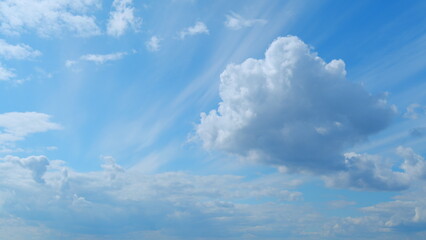 Blue heaven summer cloudscape. Rolling puffy white layered clouds are moving. Time lapse.