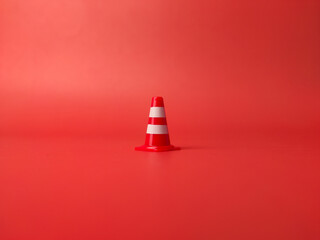 Traffic cones roadblock,mini traffic signs on a red background