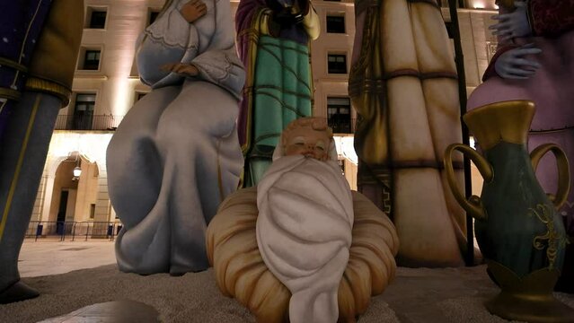 Upward shot of tallest nativity scene in the world at night. Baby Jesus, Mary and Joseph and the three Wise Men in Alicante, Spain