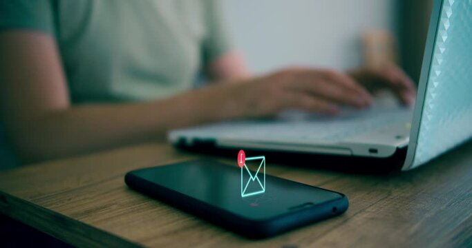 Man using laptop while smartphone have new email alert sign icon pop up. Online communication concept
