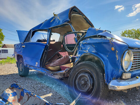 Road car accident. The car crashed. The car damege. The wheel came off. Broken minibus. Overturned car.  The car overturned. The car rolled over onto its roof. 