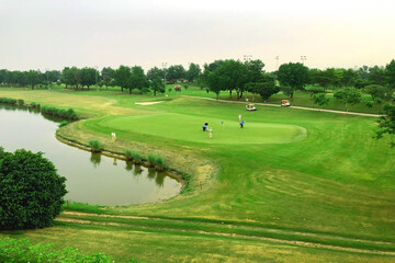 Scenic Golf Course: Players Enjoying a Day on the Green. Beautiful Golf Course