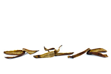 Old ugly rotten spoiled banana peels , over ripe fruit isolated on a white background, copy space.