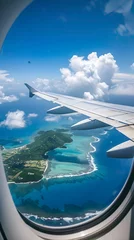 Rolgordijnen zonder boren View from a plane window of a wing over an island with turquoise ocean, white clouds in the blue sky © DeepView