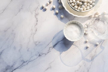 salt, cold water, reusable ceramic pie weights, basic puff pastry ingredients on white marble background