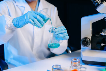 Female biotechnologist testing new chemical substances in a laboratory..