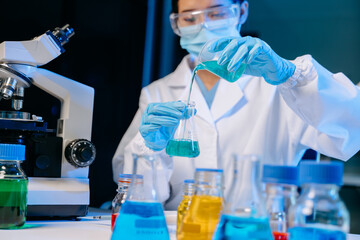 Female biotechnologist testing new chemical substances in a laboratory..