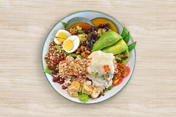 Healthy food salad plate on wooden background, top view.