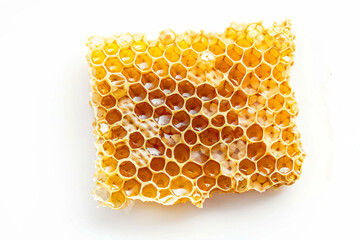 a honeycomb with honey in it on a white surface