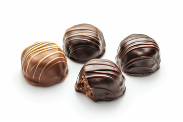 Fototapeta premium a group of chocolates sitting on top of a white surface