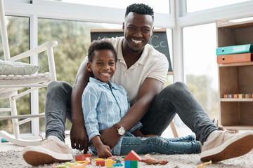 Father, child and smile in portrait with toys together in home for learning, entertainment or...