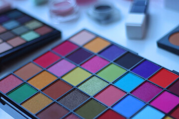 Various colorful beauty products on white background. Selective focus.