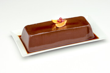 chocolate pudding in long tray on white background