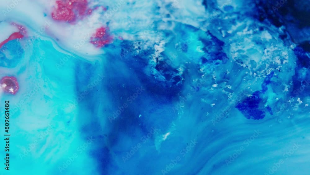 Poster vivid abstract of blue and red ink swirling in water, creating dynamic fluid patterns