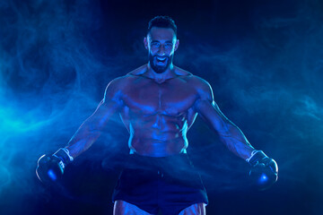 Boxer on the blue neon background. Download high resolution photo for advertising online sports...