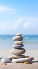 Fototapeta premium Balanced stones stacked on the beach