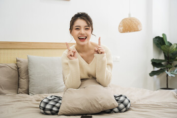 Portrait of beautiful young Asian girl at home