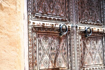 View on old arabic style wooden shutters in sunny day