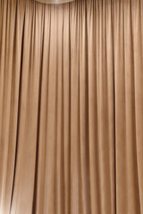 brown curtain that dropped down as a straight line. Background for inserting text, empty spaces.	