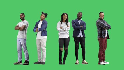 A group of people, on a green background, in full height, crossed their arms