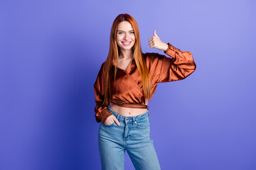 Photo of pretty young woman demonstrate thumb up wear brown shirt isolated on violet color background - obrazy, fototapety, plakaty