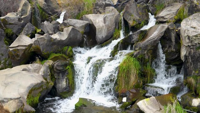 Peaceful cascading waterfall in Central Oregon river | 4K