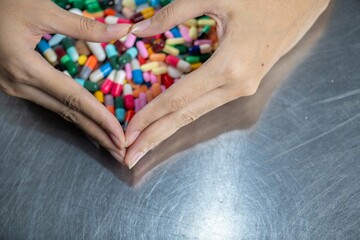 A heart made of pills and capsules.